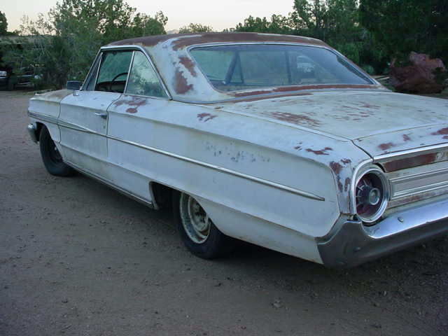 1964 Red with white top and trim Ford Galaxie 4 door