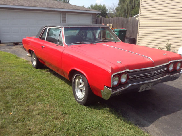 1964 Red Oldsmobile Cutlass 2 door
