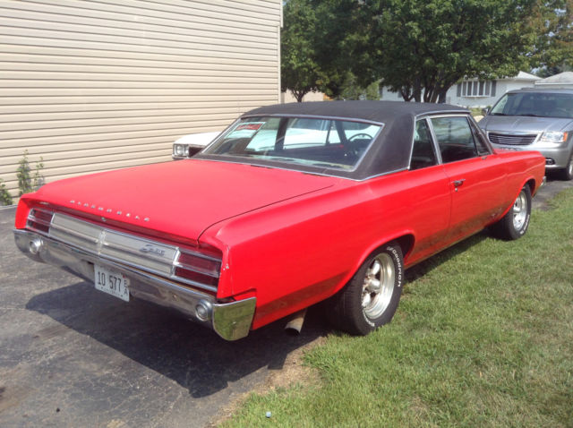 1964 Red Oldsmobile Cutlass 2 door