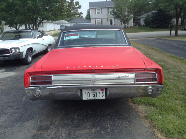 1964 Red Oldsmobile Cutlass 2 door