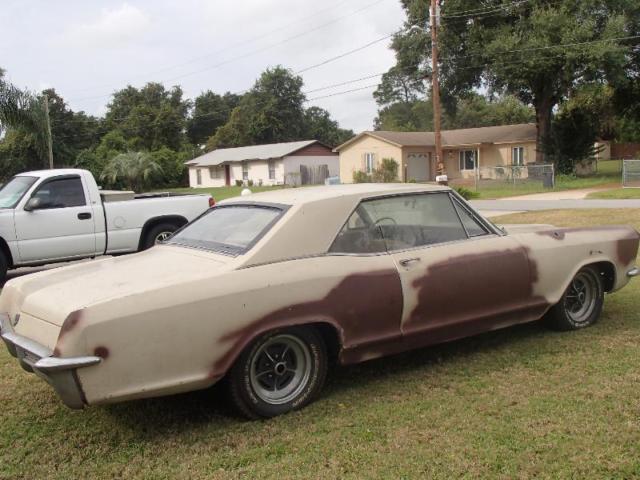 1965 tan Buick Riviera Coupe