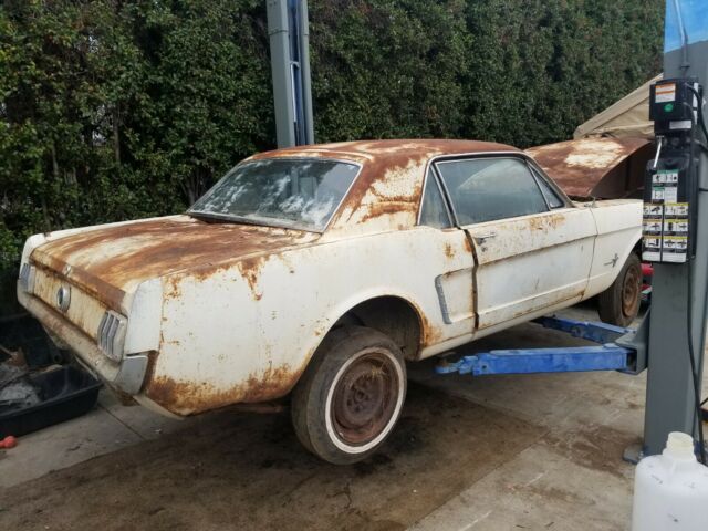 1965 white Ford Mustang Coupe