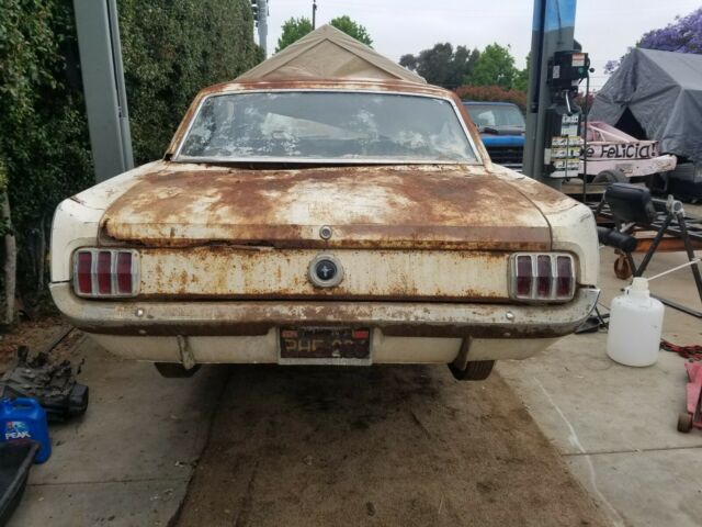 1965 white Ford Mustang Coupe