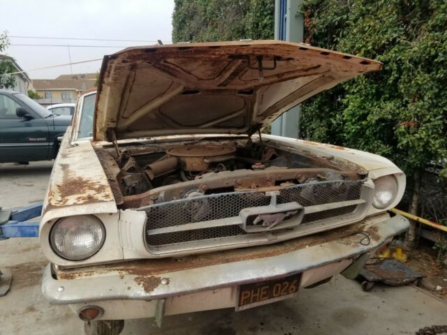 1965 white Ford Mustang Coupe
