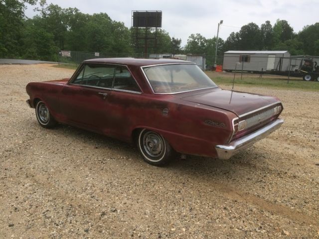 1965 maroon Chevrolet Nova Coupe