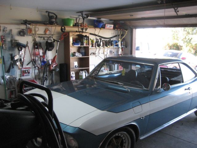 1965 blue Chevrolet Corvair 2 door