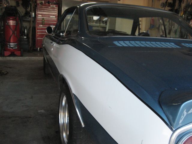 1965 blue Chevrolet Corvair 2 door