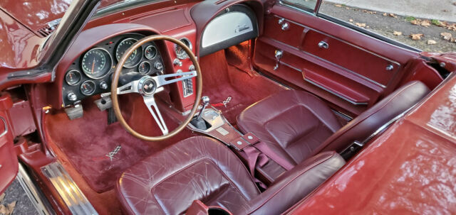 1965 maroon Chevrolet Corvette Convertible