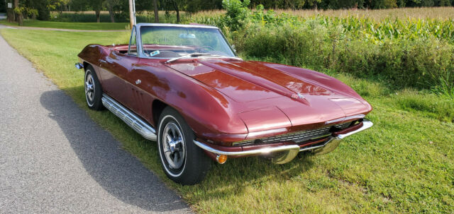 1965 maroon Chevrolet Corvette Convertible