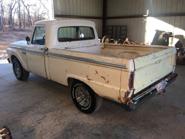 1965 White with some patina in areas. Ford F-100 Custom can short bed