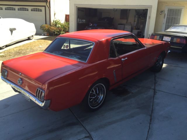 1965 red Ford Mustang Coupe