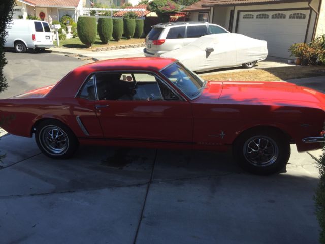 1965 red Ford Mustang Coupe