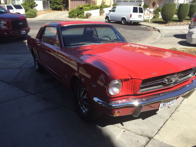 1965 red Ford Mustang Coupe
