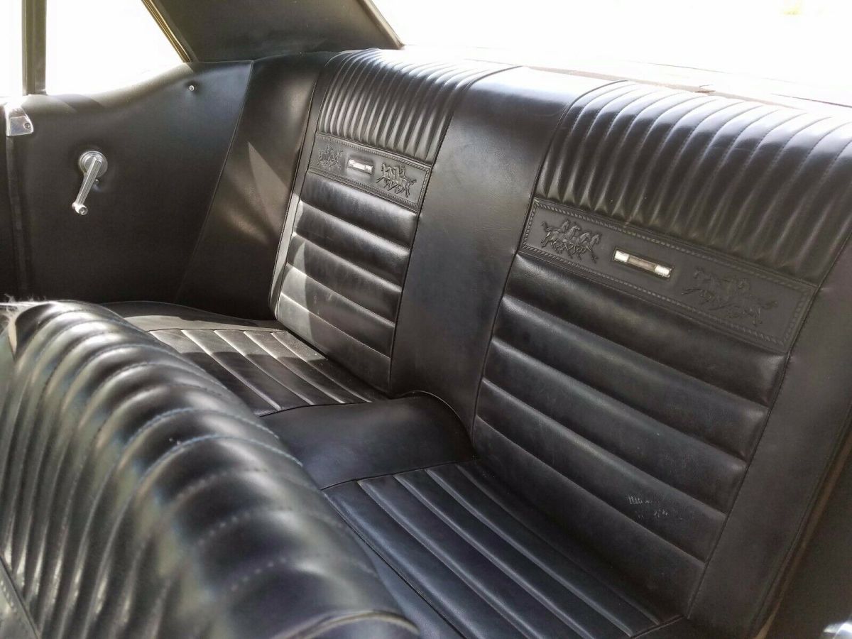 1965 yellow Ford Mustang Coupe