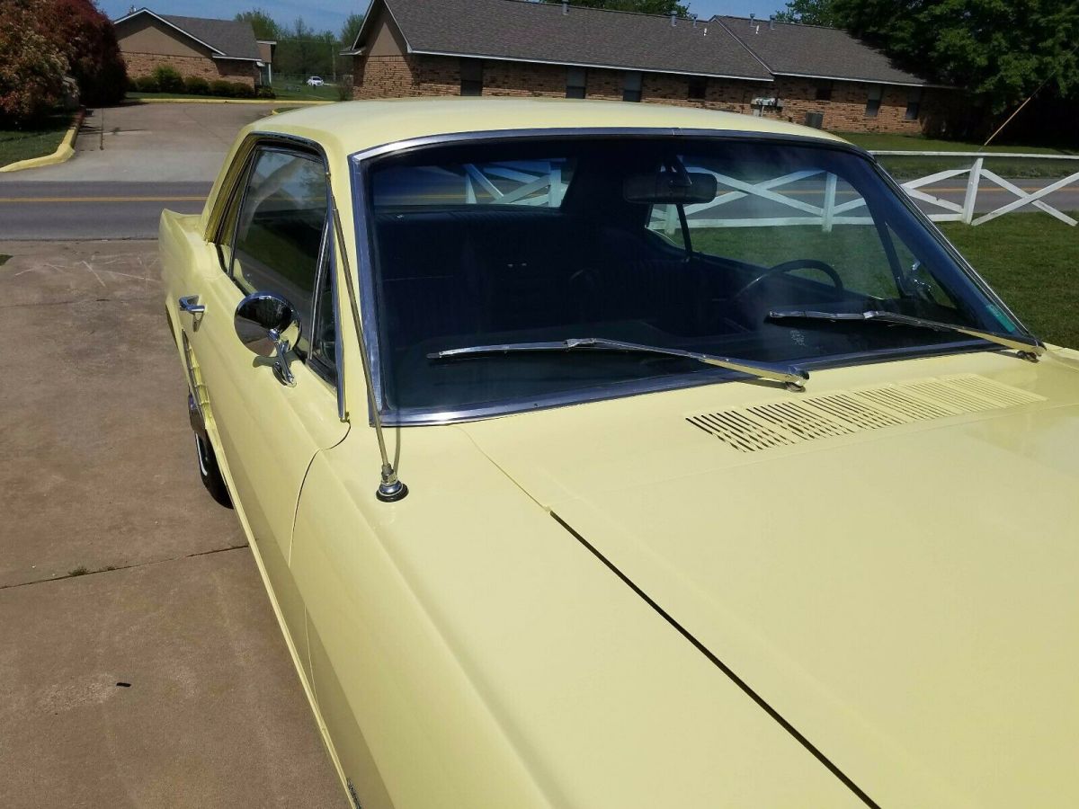 1965 yellow Ford Mustang Coupe