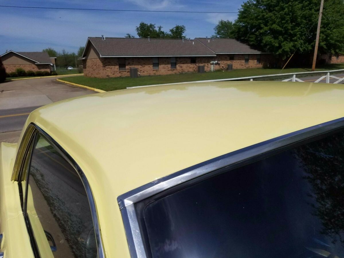 1965 yellow Ford Mustang Coupe