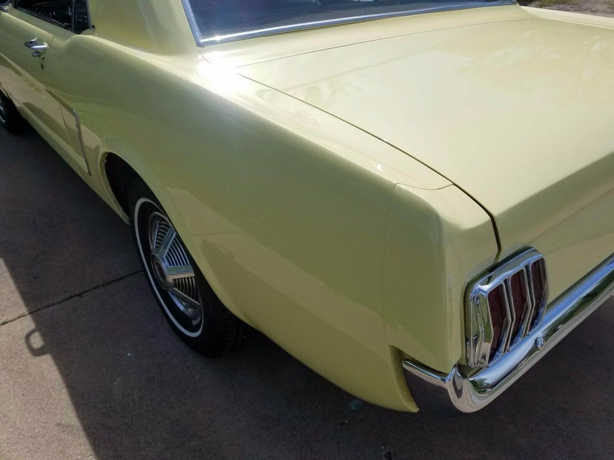 1965 yellow Ford Mustang Coupe
