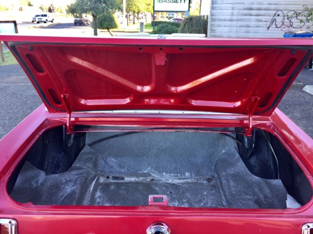 1965 red Ford Mustang Convertible