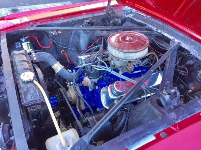 1965 red Ford Mustang Convertible