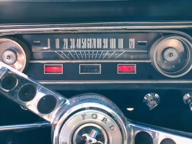 1964 vintage bergundy Ford Mustang