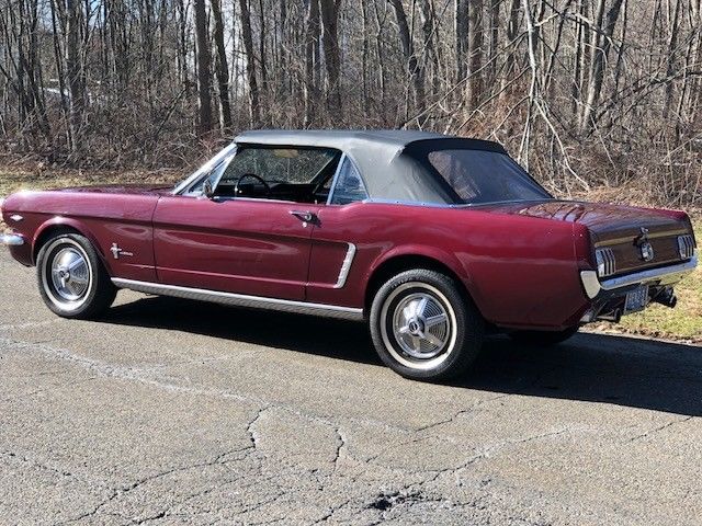 1964 vintage bergundy Ford Mustang