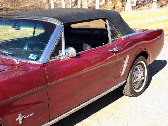 1964 vintage bergundy Ford Mustang