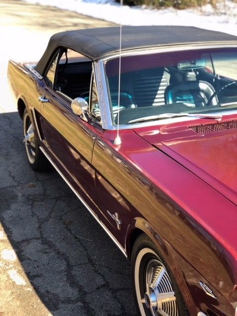 1964 vintage bergundy Ford Mustang