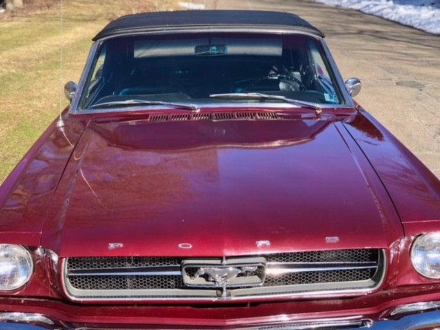 1964 vintage bergundy Ford Mustang