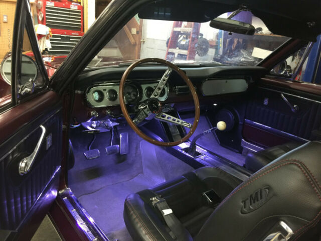 1965 red Ford Mustang Coupe