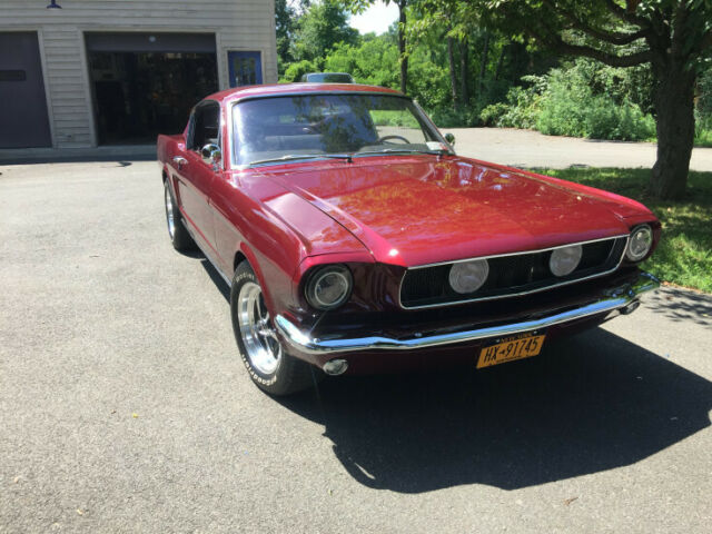 1965 red Ford Mustang Coupe