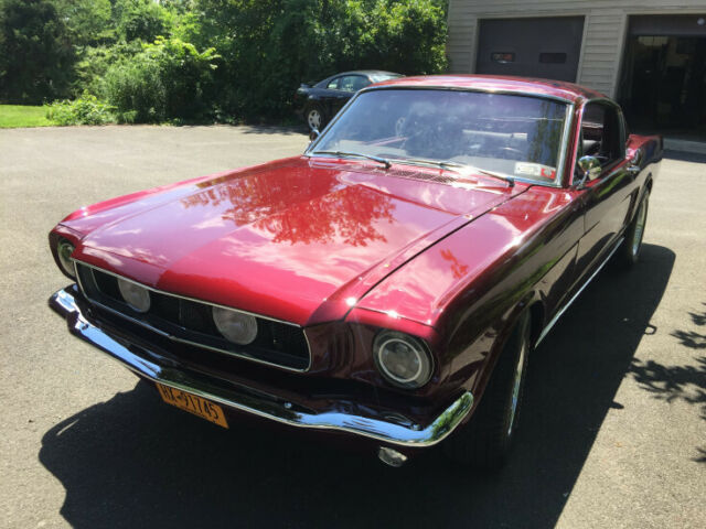 1965 red Ford Mustang Coupe