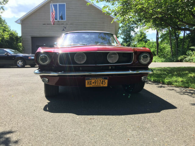 1965 red Ford Mustang Coupe