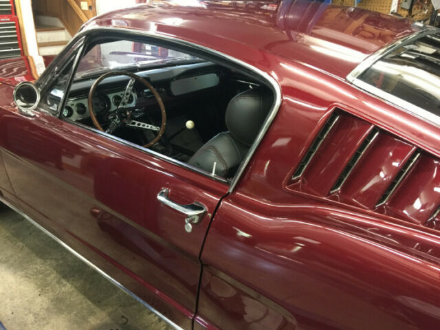 1965 red Ford Mustang Coupe
