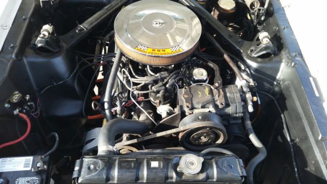 1965 white Ford Mustang Hardtop