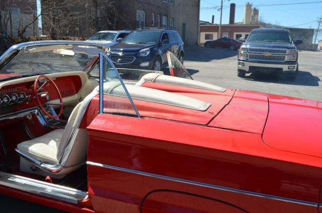 1965 red Ford Thunderbird