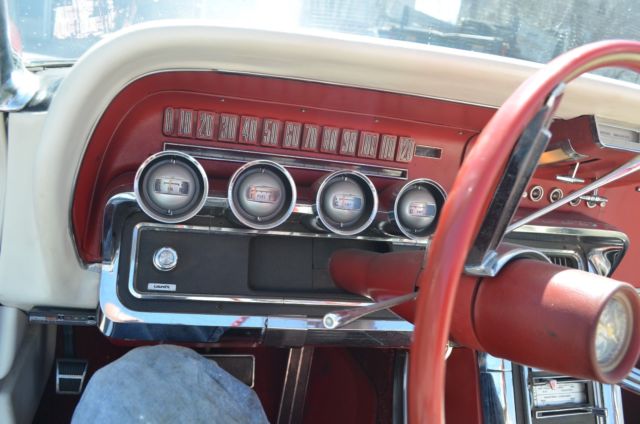 1965 red Ford Thunderbird