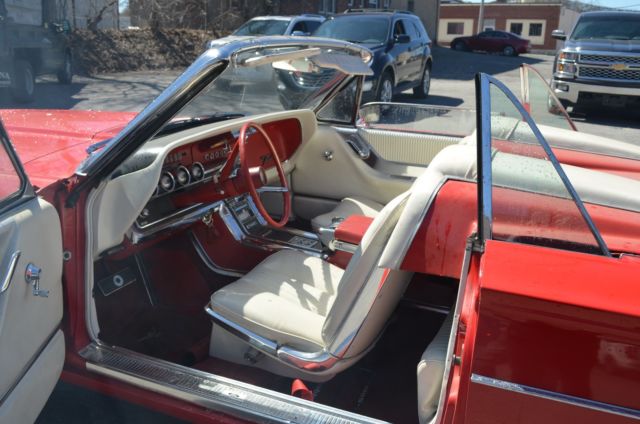 1965 red Ford Thunderbird