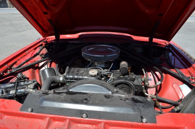 1965 red Ford Thunderbird