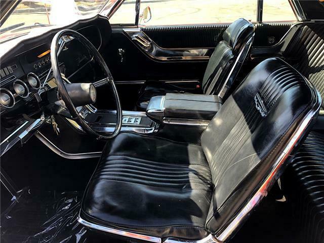 1965 Red Ford Thunderbird coupe