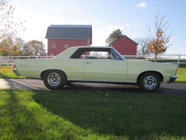 1965 yellow Pontiac GTO hardtop