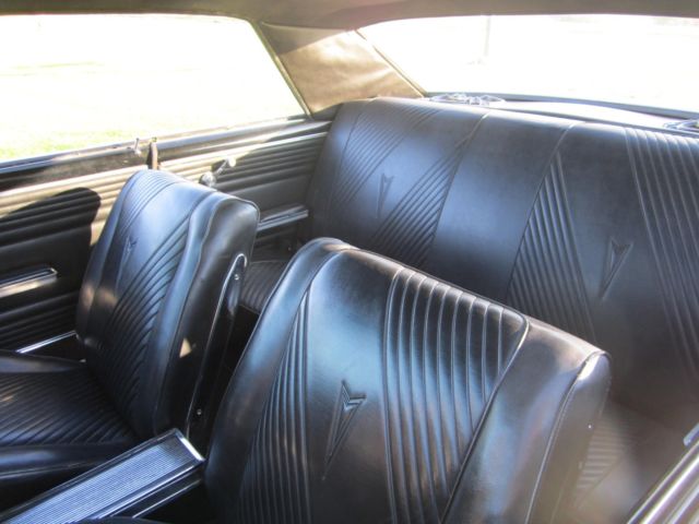 1965 yellow Pontiac GTO hardtop