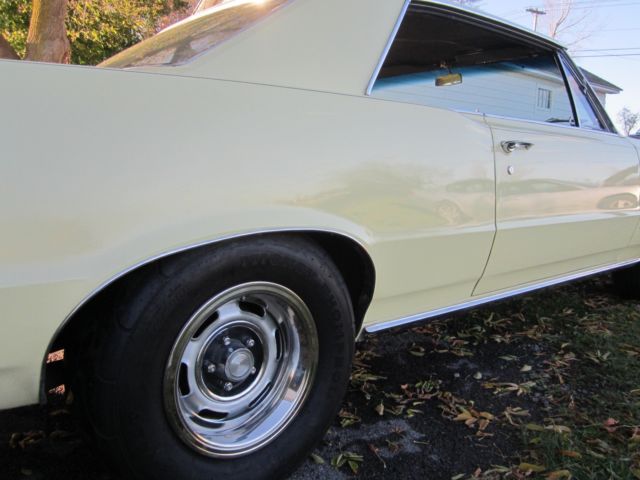 1965 yellow Pontiac GTO hardtop
