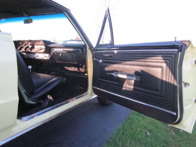 1965 yellow Pontiac GTO hardtop