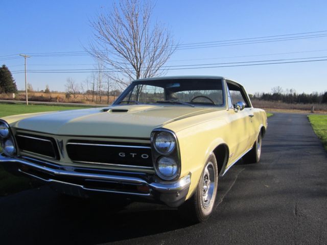 1965 yellow Pontiac GTO hardtop