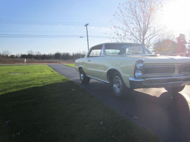 1965 yellow Pontiac GTO hardtop