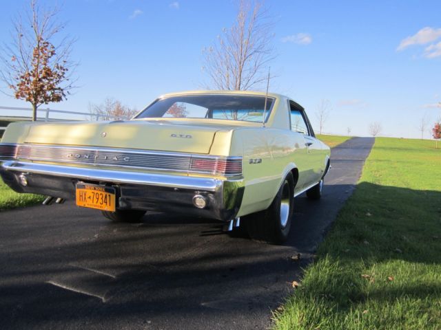 1965 yellow Pontiac GTO hardtop