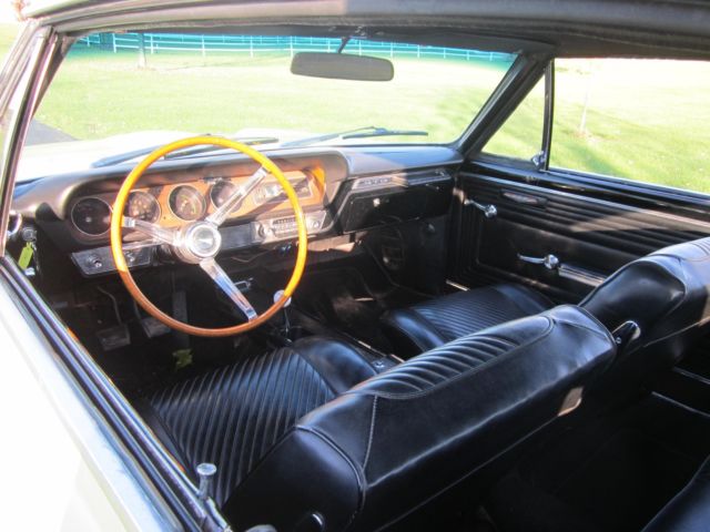 1965 yellow Pontiac GTO hardtop