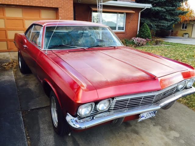 1965 red Chevrolet Impala Coupe