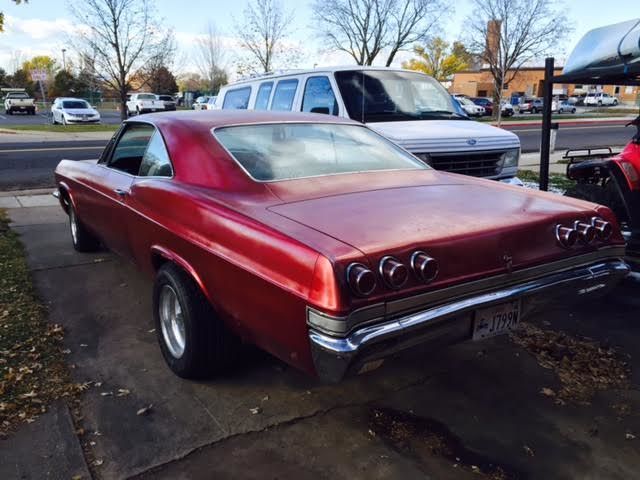 1965 red Chevrolet Impala Coupe