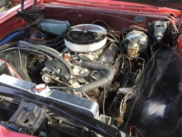 1965 red Chevrolet Impala Coupe